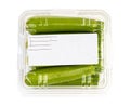 Packed and labeled green zucchini isolated on white background