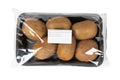 Packed and labeled kiwi on isolated white background