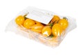 Packed and labeled yellow cherry tomatoes on an isolated white background