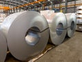 Packed rolls of coil steel in stock waiting for move to process slitter Royalty Free Stock Photo