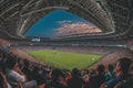 A packed stadium with thousands of enthusiastic soccer fans watching an intense match, A panoramic view of a crowded rugby stadium Royalty Free Stock Photo