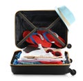 Packed suitcase with clothes and passports Royalty Free Stock Photo