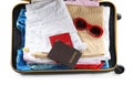 Packed suitcase with clothes and passports on white background Royalty Free Stock Photo