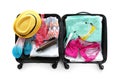 Packed suitcase with summer clothes and accessories on white background Royalty Free Stock Photo