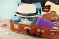 Packed vintage suitcase for summer holidays, vacation, travel and trip. Royalty Free Stock Photo