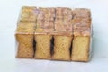 A packet of crispy rusk toast, dry cake biscuits on a light wooden background Royalty Free Stock Photo