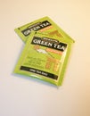 Packets of Bigelow decaffeinated green tea on white background