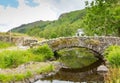 Packhorse bridge Watendlath Tarn Lake District Cumbria England UK Royalty Free Stock Photo