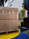 Packing accessories at workplace of industry,Semi-Automatic Stretch Wrap Machines,Wrap Machines are Best for Pallet Wrapping Jobs. Royalty Free Stock Photo