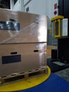 Packing accessories at workplace of industry,Semi-Automatic Stretch Wrap Machines,Wrap Machines are Best for Pallet Wrapping Jobs. Royalty Free Stock Photo
