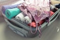 Packing clothes into travel bag - Luggage and people concept