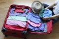 Packing clothing up preparatory to journey Royalty Free Stock Photo