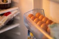 Packing eggs in a cardboard box. Eggs in the fridge Royalty Free Stock Photo