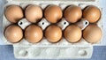 Packing eggs in a cardboard box top Royalty Free Stock Photo