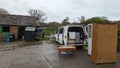 Packing a home removals van truck full of furniture on a farm courtyard Royalty Free Stock Photo