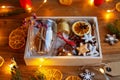 Packing homemade seasonal gift box or self care package with ingredients for preparing traditional hot mulled wine.