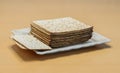 Packing matzo for Pesach square shape lies on a plate on the table