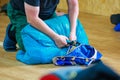 Packing a parachute into a backpack.