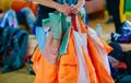 Packing a parachute into a backpack.