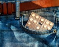 Packing of pills in a pocket of blue jeans Royalty Free Stock Photo