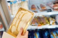 Packing of salmon fish in the hand of the buyer at the grocery store