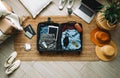 Packing suitcase for travel vacation in new normal, top view Royalty Free Stock Photo