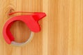 Packing tape dispenser on a wood desk Royalty Free Stock Photo