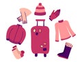 Packing warm clothes in suitcase. Set of clothes. Luggage for winter travel. Sweater, socks, jacket. Hat, scarf, gloves