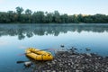 Packrafting concept with yellow packraft boat