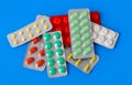 Packs of pills on blue background Royalty Free Stock Photo