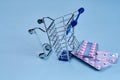 packs of pills in a trolley shopping in a pharmacy medicines