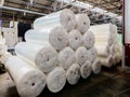 Packs of rolled foam rubber in warehouse