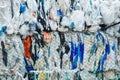 Packs and Stocks of Wrapped Scrap Plastic Dedicated for Eco Recycling in front of a Recycling Factory