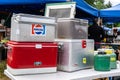 Vendor Booth display of vintage ice chest coolers at Annual Community Flea Market