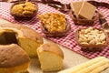 Pacoca, Pe de Moleque, Peanut, Cookie, Cake, Corn: food of Festa Junina, a typical brazilian party. On red and white plaid patter