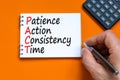 PACT patience action consistency time symbol. Concept words PACT patience action consistency time on white note, orange background