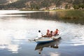 pacucha lake and boat with tourists sailing on a summer day in andahuaylas peru
