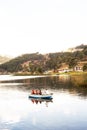 pacucha lake with boat with tourists sailing on a summer day in andahuaylas peru