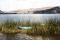 pacucha lake with and wooden boat anchored in reed plantation splendid on a summer day in andahuaylas peru Royalty Free Stock Photo