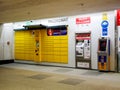 Paczkomat InPost, yellow parcel locker, Krakow main train station, shopping mall. Simple self service mail package locker machine