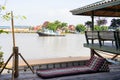 A pad or cushion in Thai Lanna style in Northern culture of Thailand in front of traditional Thai home terrace next to the river s