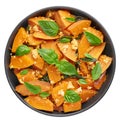 Pad Faktong or Thai Stir-fried Pumpkin in black bowl isolated on white background. Thai Food. Fried squash Royalty Free Stock Photo