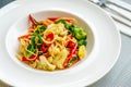 Pad Kee Mao or Thai fusion food, stirred fried spaghetti with spicy herbs, meat, and fresh vegetables. Beautiful Thai food in a Royalty Free Stock Photo