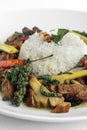 .Pad Krapow Gai spicy Thai Chicken Vegetable Stir Fry on white plate Royalty Free Stock Photo