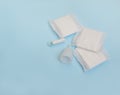 Pad, menstrual cup, tampon on a blue background. The view is flat. Concept of critical days, menstruation Royalty Free Stock Photo