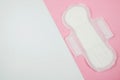Pad, sanitary napkin on a pink and white background. Menstruation, feminine hygiene, top view Royalty Free Stock Photo