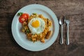 Pad Thai noodles with Omelette and tomato on wooden table