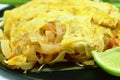 Pad Thai stir fried rice noodles with dry shrimp wrapped with egg on plate Royalty Free Stock Photo