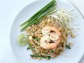 Pad Thai, stir-fried rice noodles with shrimp in white dish on white background. The one of Thailand's national main dish. th Royalty Free Stock Photo