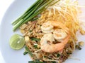 Pad Thai, stir-fried rice noodles with shrimp in white dish on white background. The one of Thailand's national main dish. th Royalty Free Stock Photo